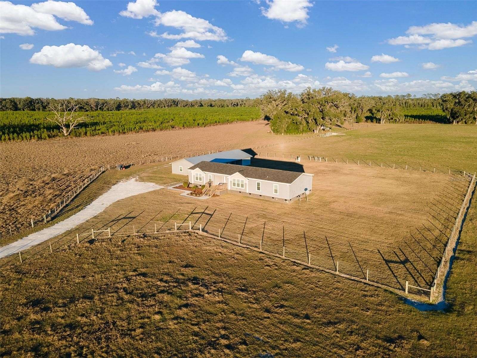 9.83 Acres of Land with Home for Sale in Newberry, Florida
