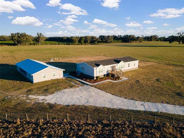 9.83 Acres of Land with Home for Sale in Newberry, Florida