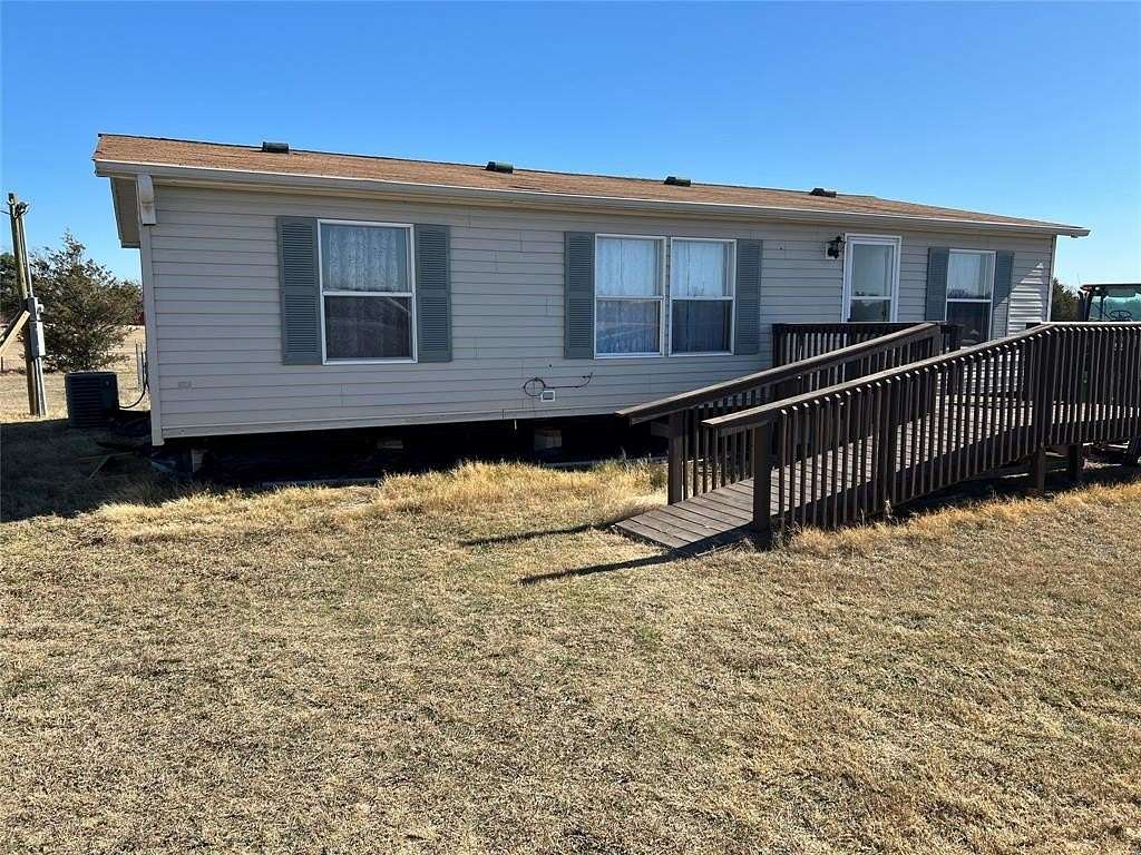 5.69 Acres of Residential Land with Home for Sale in Bonham, Texas