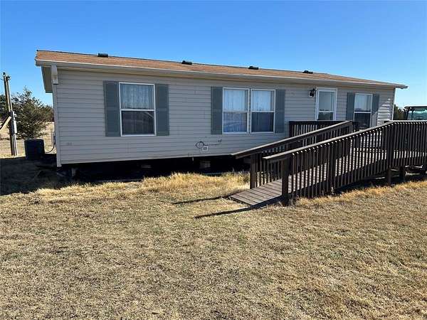 5.69 Acres of Residential Land with Home for Sale in Bonham, Texas