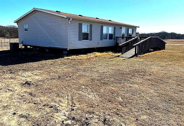 5.69 Acres of Residential Land with Home for Sale in Bonham, Texas