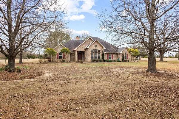 10.4 Acres of Land with Home for Sale in Powderly, Texas