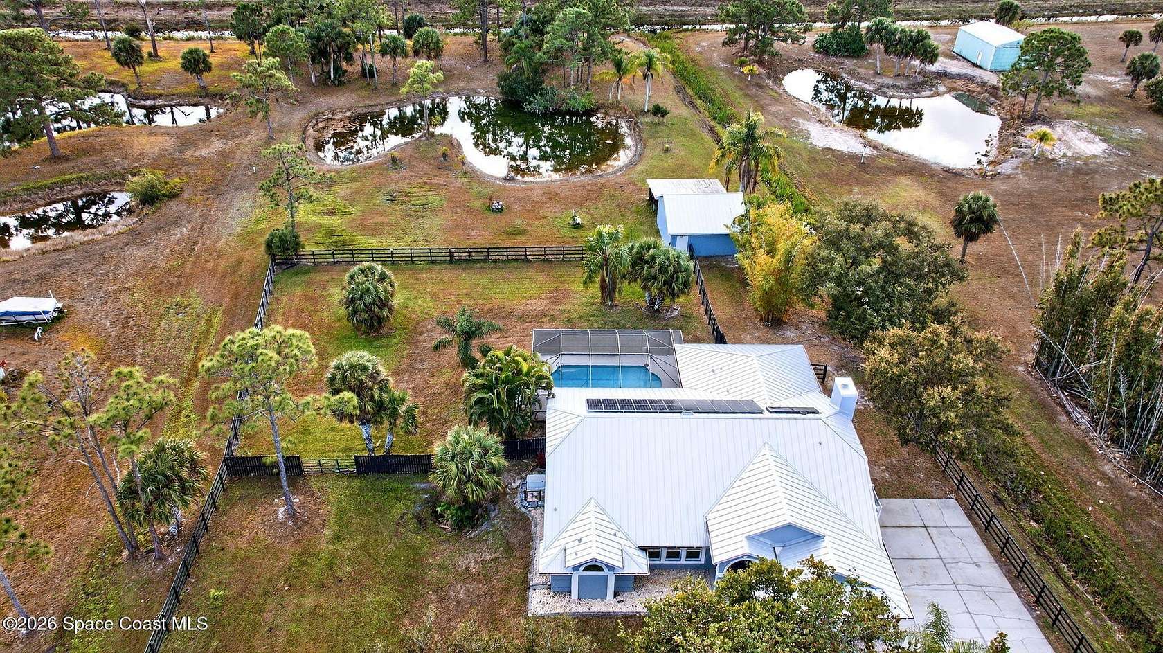 2.63 Acres of Residential Land with Home for Sale in Palm Bay, Florida