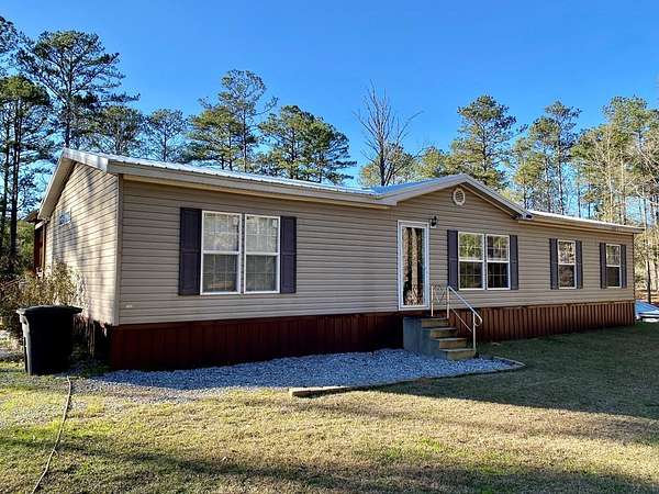 8.67 Acres of Land with Home for Sale in Carriere, Mississippi