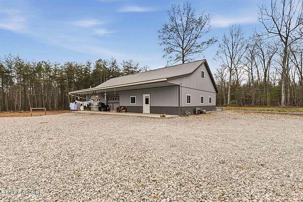 7.46 Acres of Land with Home for Sale in Deer Lodge, Tennessee