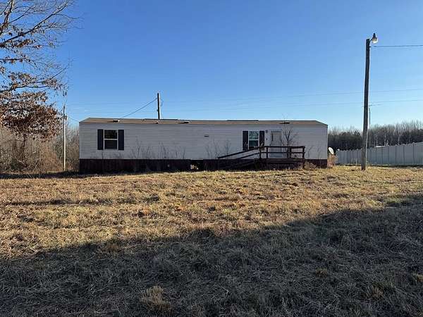 9.1 Acres of Land with Home for Sale in Big Sandy, Tennessee