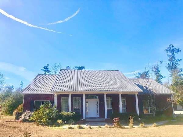 5.7 Acres of Residential Land with Home for Sale in Wewahitchka, Florida