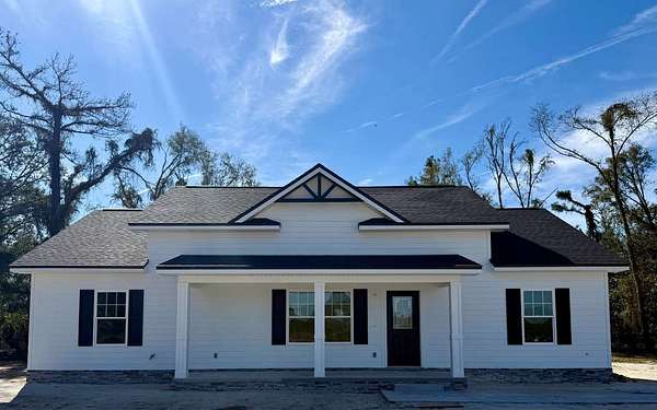 1.62 Acres of Residential Land with Home for Sale in Live Oak, Florida