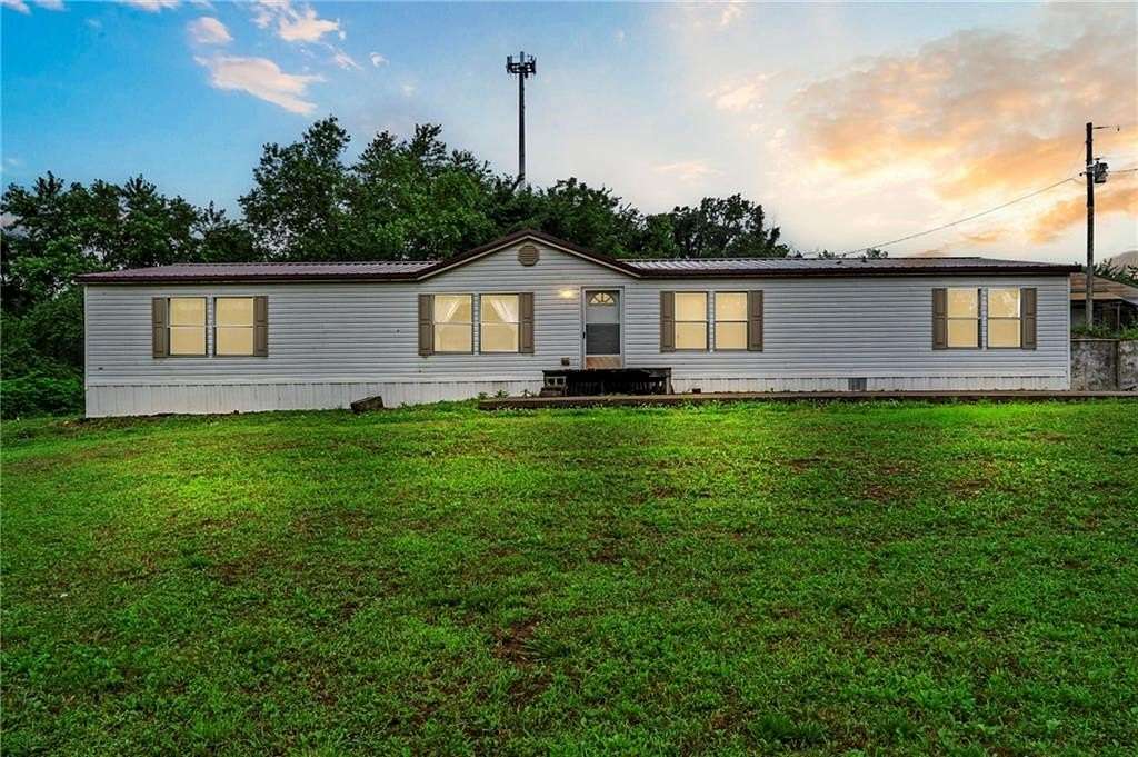 6.45 Acres of Land with Home for Sale in Gentry, Arkansas