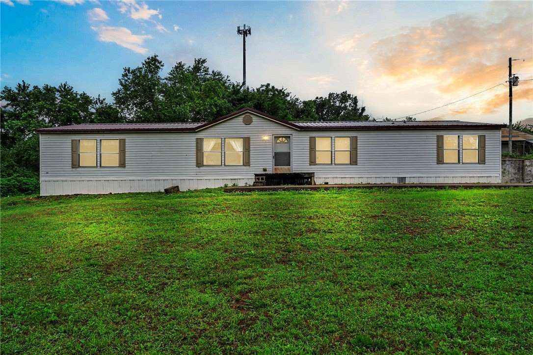 6.45 Acres of Land with Home for Sale in Gentry, Arkansas