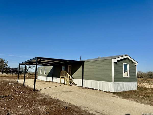 4 Acres of Residential Land with Home for Sale in Devine, Texas