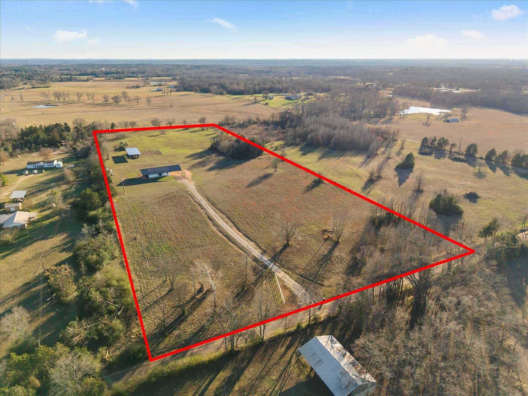 12.7 Acres of Recreational Land with Home for Sale in Mount Pleasant, Texas