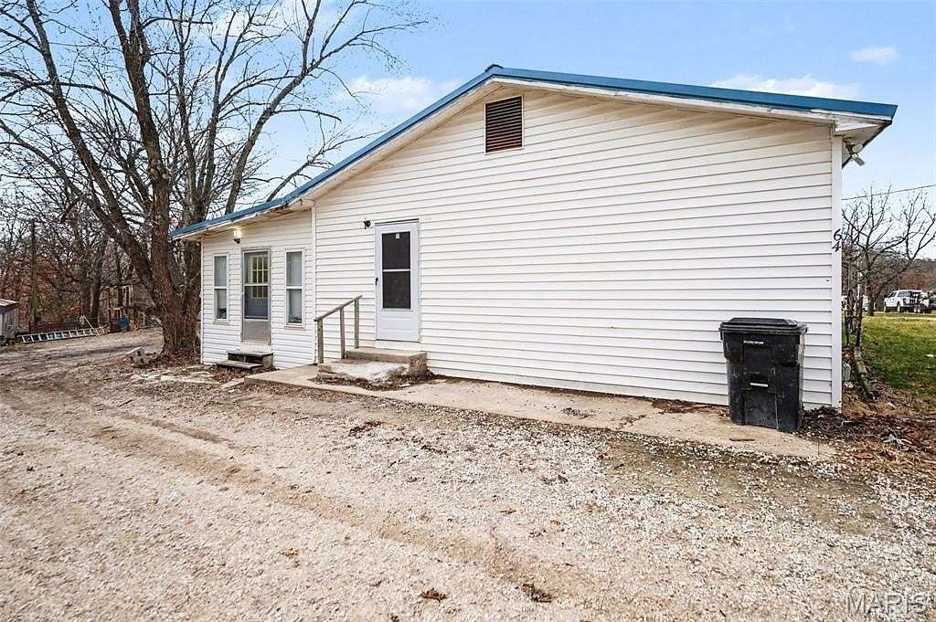 5 Acres of Land with Home for Sale in Hawk Point, Missouri