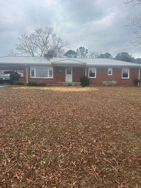 4.2 Acres of Residential Land with Home for Sale in Camden, Tennessee