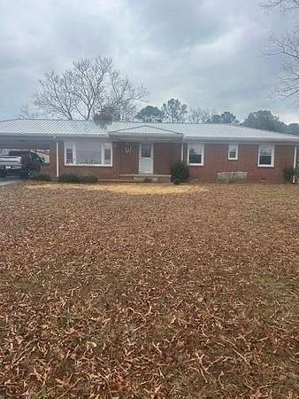 4.2 Acres of Residential Land with Home for Sale in Camden, Tennessee