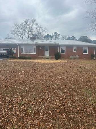 4.2 Acres of Residential Land with Home for Sale in Camden, Tennessee