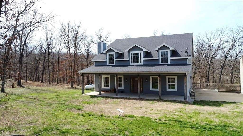 3.16 Acres of Land with Home for Sale in Gravette, Arkansas