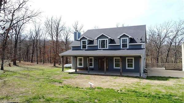 3.16 Acres of Land with Home for Sale in Gravette, Arkansas