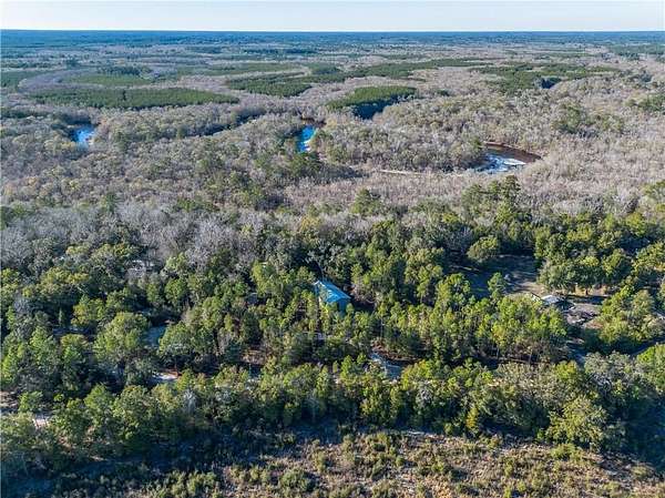 6.7 Acres of Residential Land with Home for Sale in White Oak, Georgia