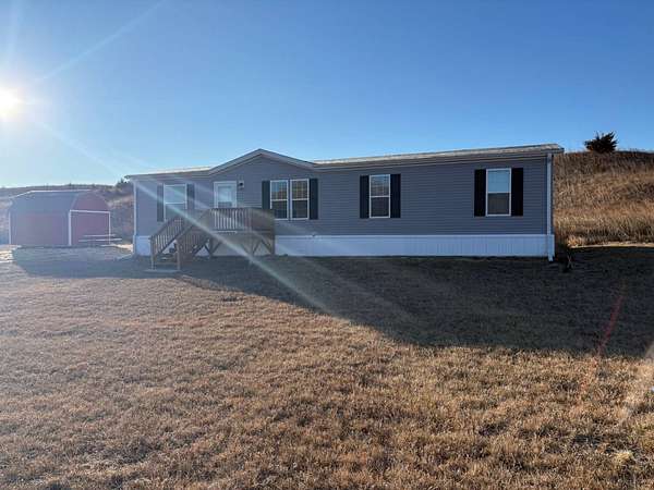 11.5 Acres of Recreational Land with Home for Sale in Burwell, Nebraska