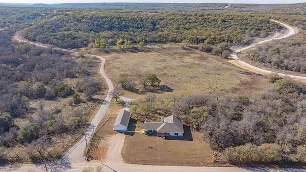 2 Acres of Residential Land with Home for Sale in Mingus, Texas