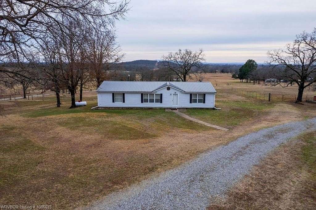 5.63 Acres of Residential Land with Home for Sale in Gans, Oklahoma