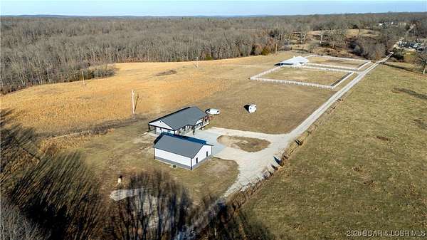 21.2 Acres of Recreational Land with Home for Sale in Roach, Missouri