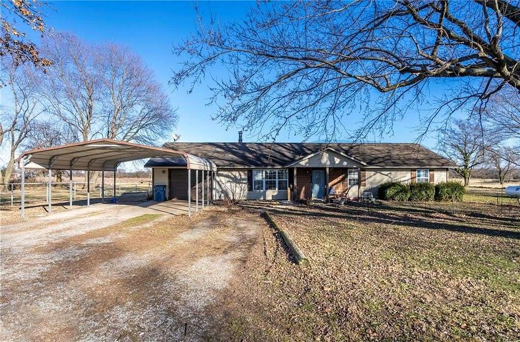 5.77 Acres of Land with Home for Sale in Gentry, Arkansas