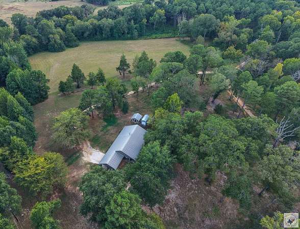32.6 Acres of Recreational Land with Home for Sale in Douglassville, Texas