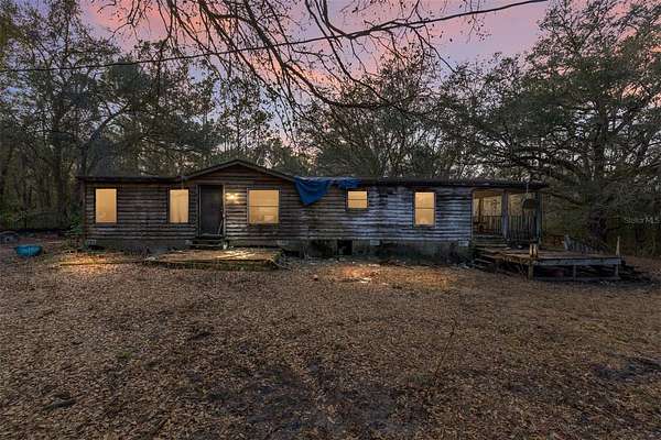 4.77 Acres of Residential Land with Home for Sale in Fort McCoy, Florida