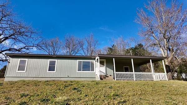 8 Acres of Land with Home for Sale in Harrison, Arkansas