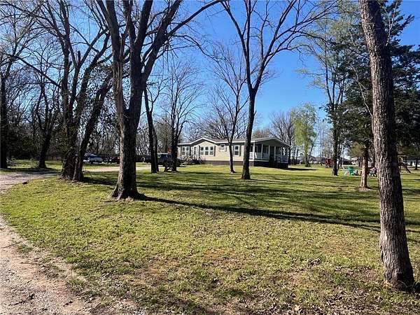 2 Acres of Land with Home for Sale in Gravette, Arkansas