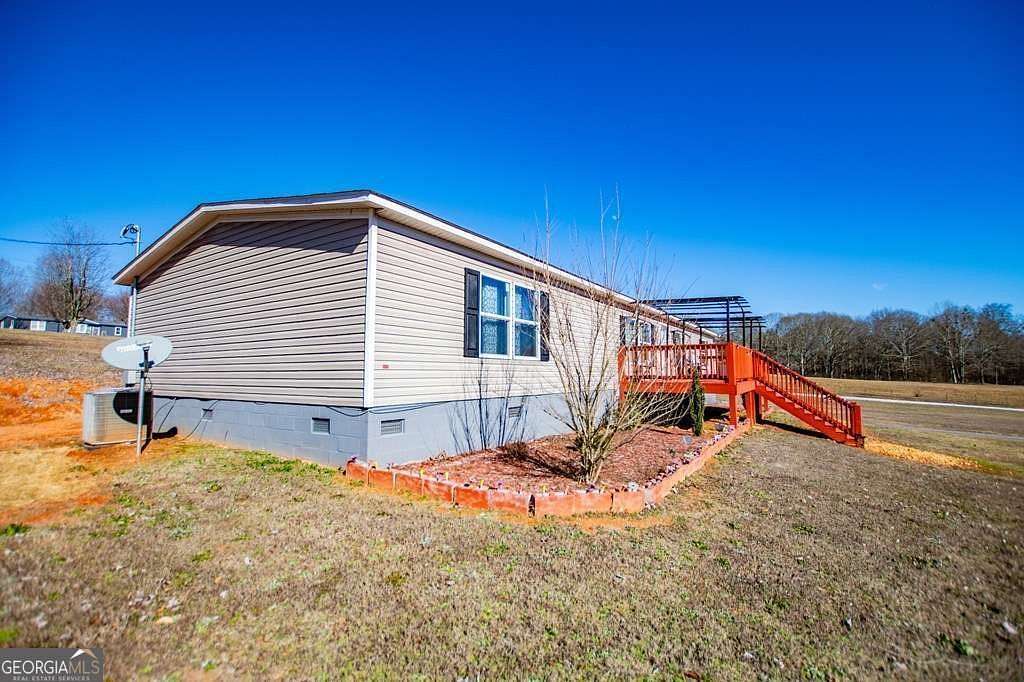 6.39 Acres of Land with Home for Sale in Roopville, Georgia