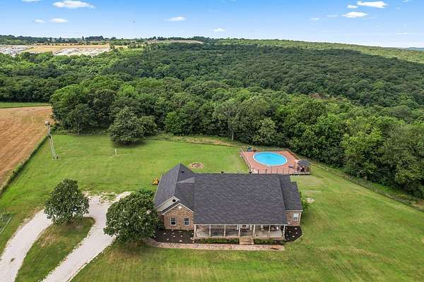 10.4 Acres of Land with Home for Sale in Prairie Grove, Arkansas