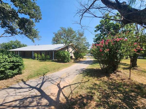 10 Acres of Residential Land with Home for Sale in Harrah, Oklahoma