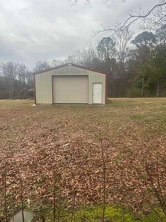 4.2 Acres of Improved Commercial Land for Sale in Camden, Tennessee