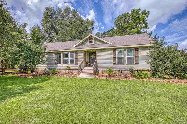 3.55 Acres of Residential Land with Home for Sale in Pace, Florida