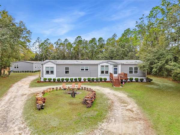 5 Acres of Residential Land with Home for Sale in Fort White, Florida