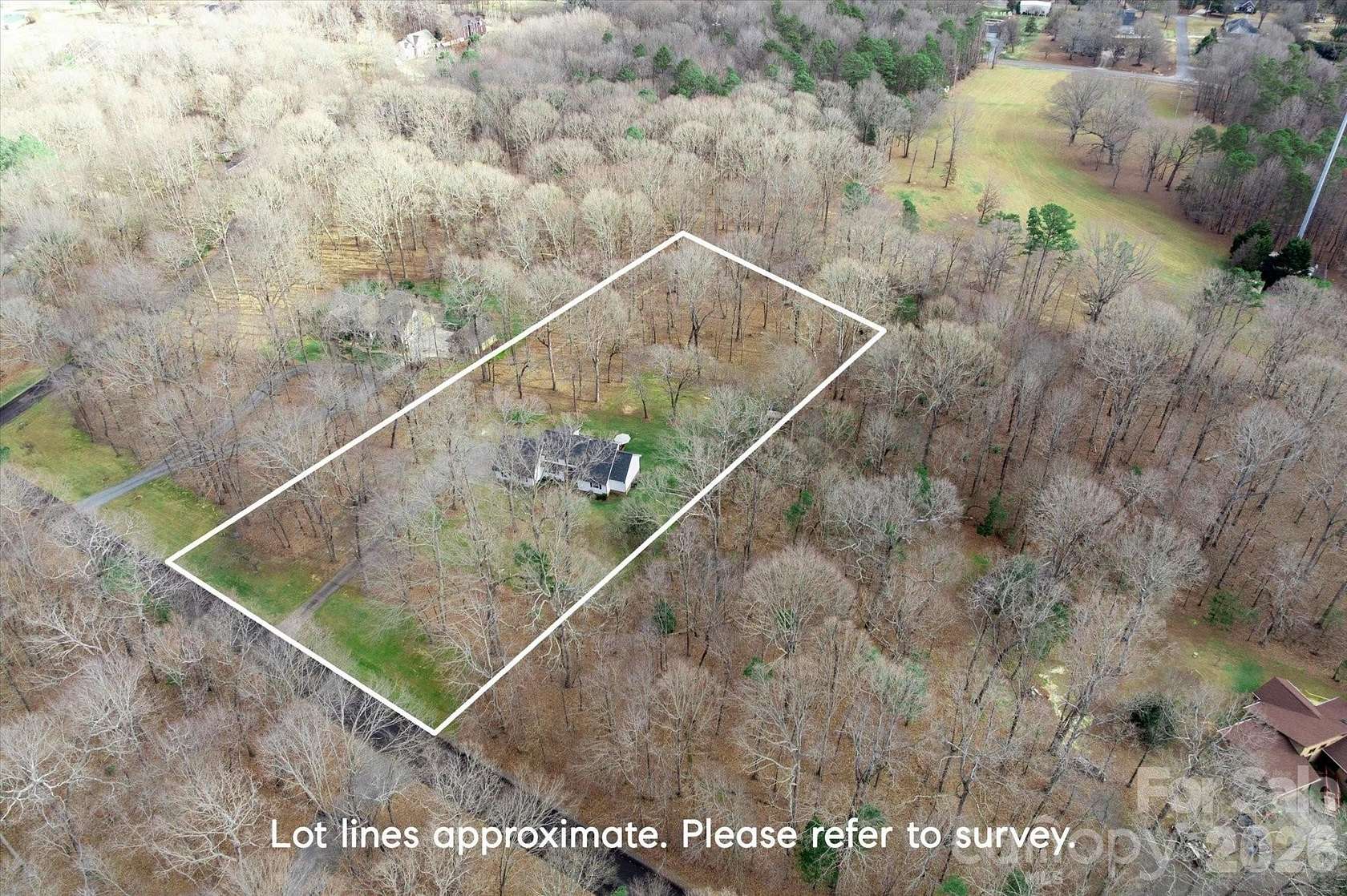2.35 Acres of Residential Land with Home for Sale in Matthews, North Carolina