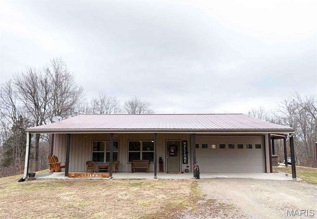 69.7 Acres of Recreational Land with Home for Sale in Jackson, Missouri