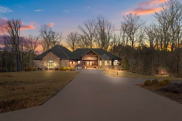 7.36 Acres of Residential Land with Home for Sale in Camden, Tennessee