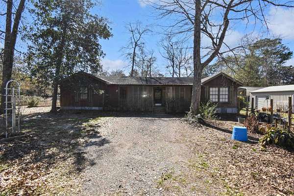 5.5 Acres of Residential Land with Home for Sale in Kountze, Texas