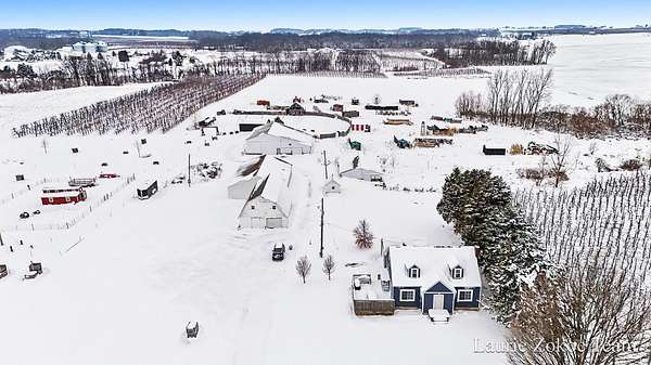 40 Acres of Agricultural Land with Home for Sale in Sparta, Michigan