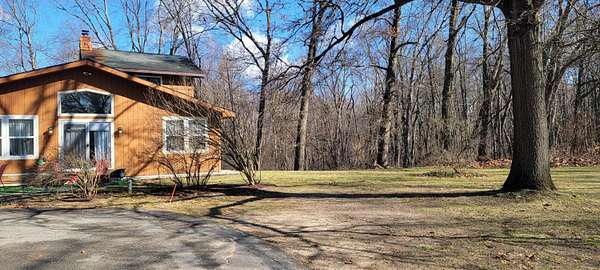 10.4 Acres of Land with Home for Sale in Portage, Michigan