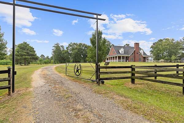 61.8 Acres of Land with Home for Sale in Timpson, Texas