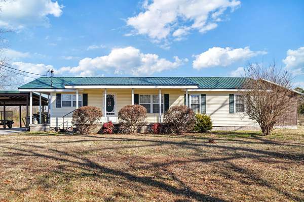 7.62 Acres of Residential Land with Home for Auction in Ooltewah, Tennessee