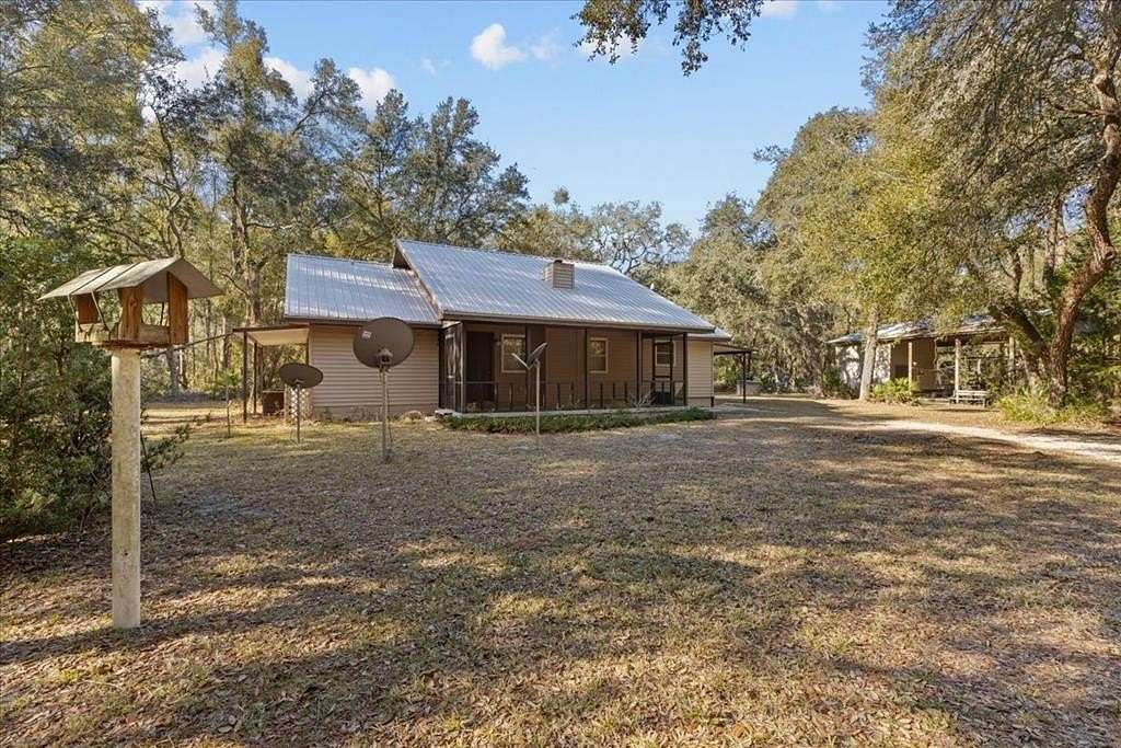 4.9 Acres of Residential Land with Home for Sale in Chiefland, Florida