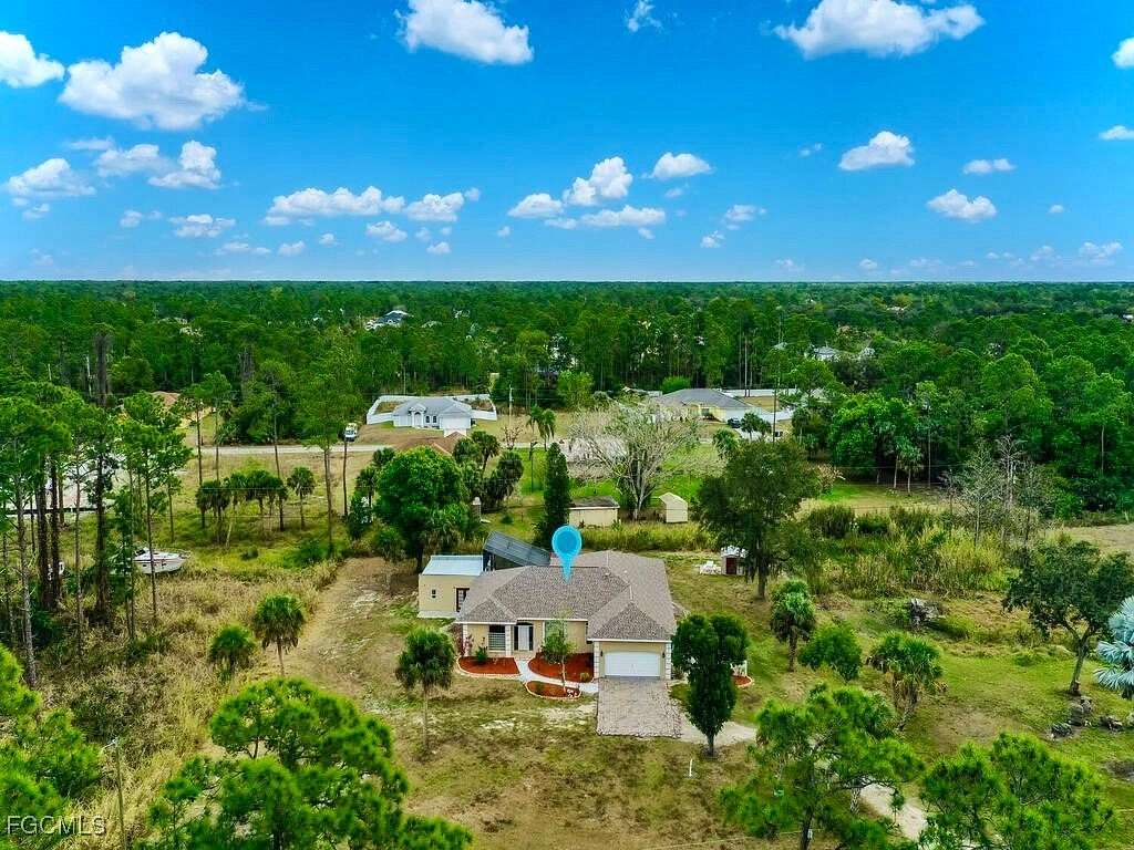 1.5 Acres of Residential Land with Home for Sale in Lehigh Acres, Florida
