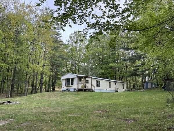 40.5 Acres of Recreational Land with Home for Sale in Chase, Michigan