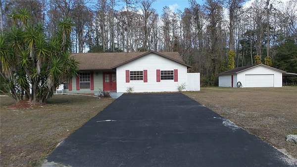 2.69 Acres of Residential Land with Home for Sale in New Port Richey, Florida